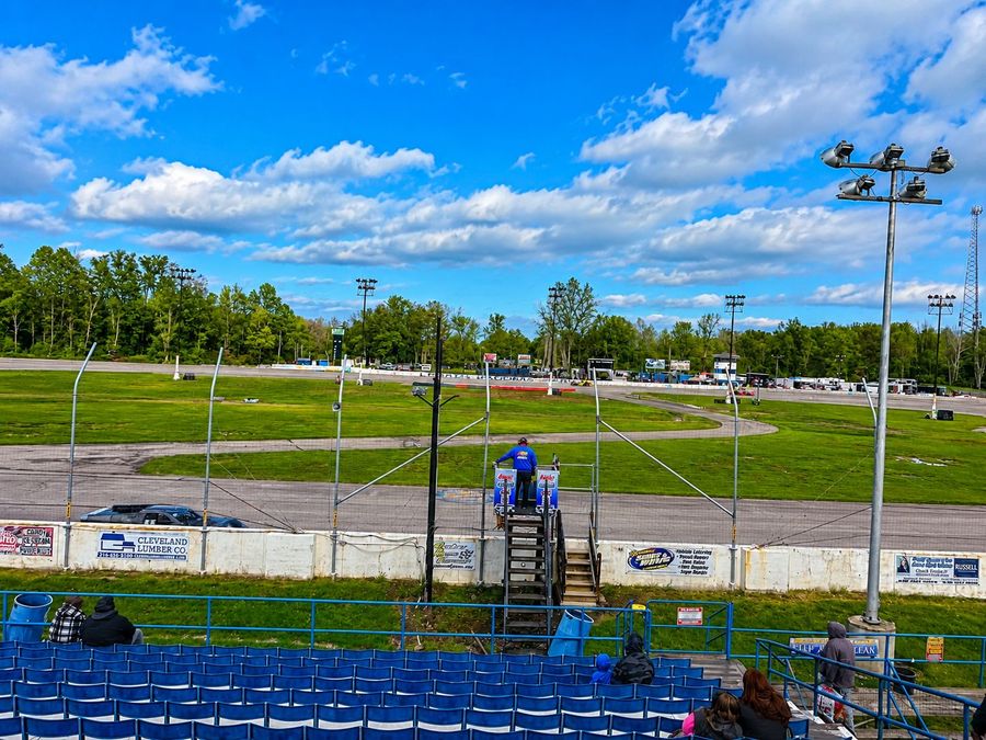 The flag stand above the front stretch