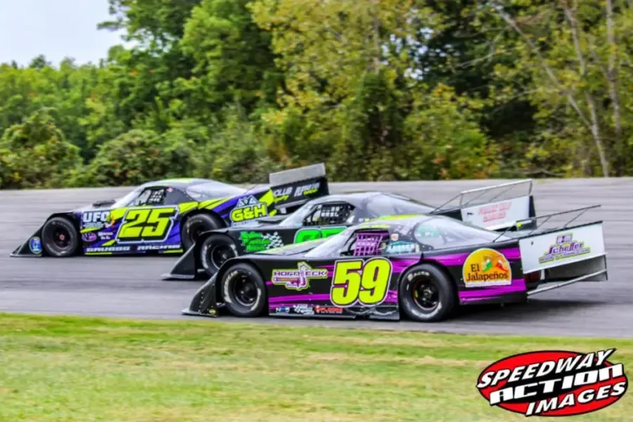 Late models three wide down the backstretch