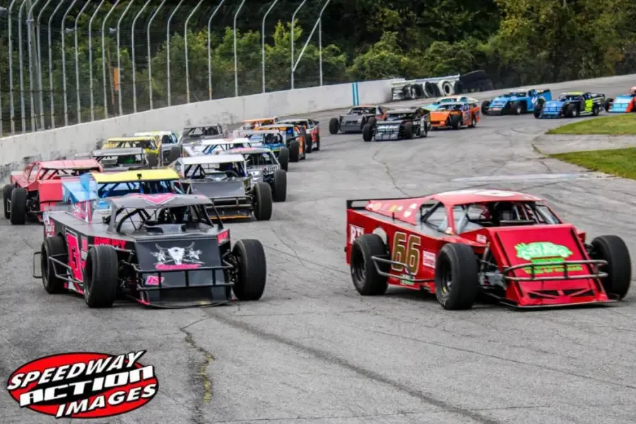 Modifieds pack up behind the 66 on the restart