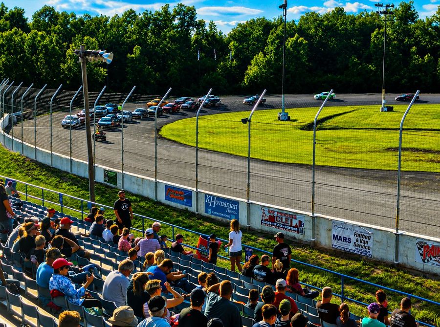 Fans watching cars through the turn