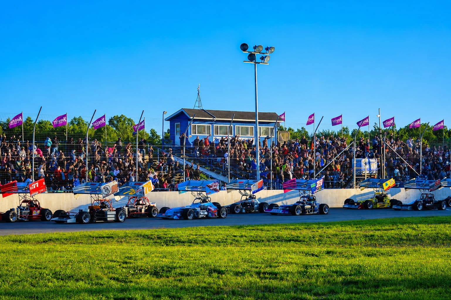 Packed grandstands and flags along the front stretch at Lorain Raceway Park